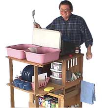 Ken Ralston with the first version Camp Kitch Mates camp kitchen.